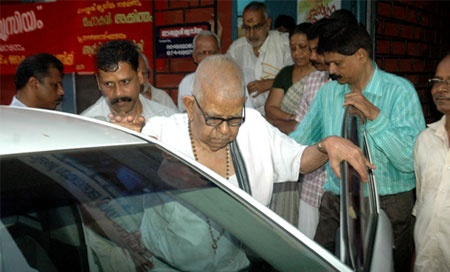 Treasurer Suresh Warriyar with Mahakavi Akkitham
